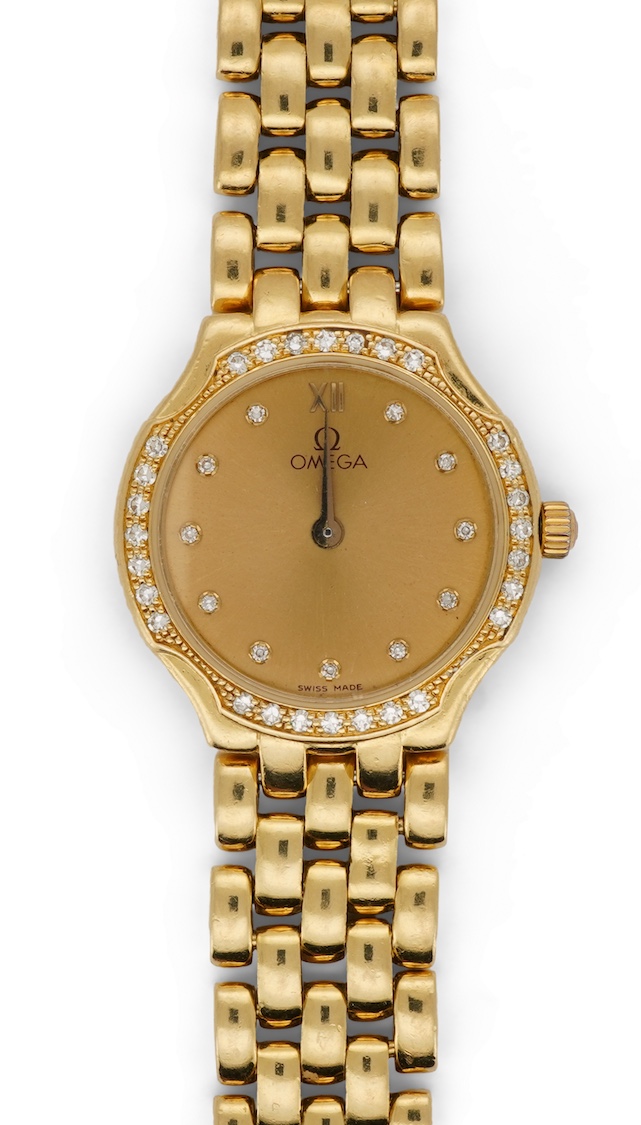 A lady's recent 18ct gold Omega quartz dress wrist watch, with diamond dot markers and diamond set bezel